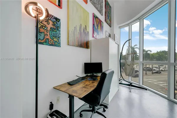 a view of a workspace with furniture