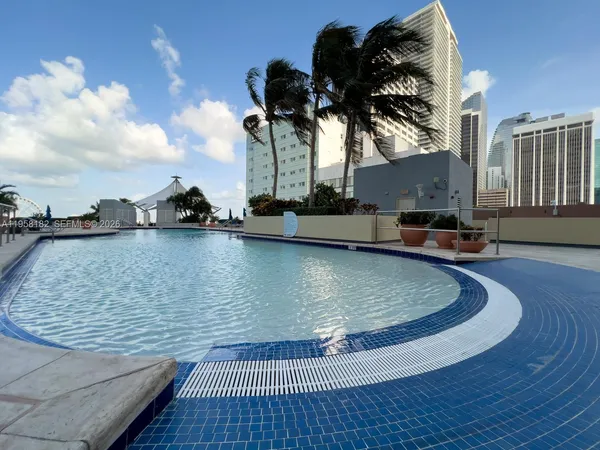 a view of a swimming pool with a house