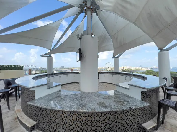 a dining room with a table and chairs