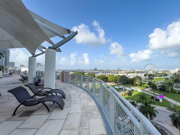 a balcony with furniture and city view