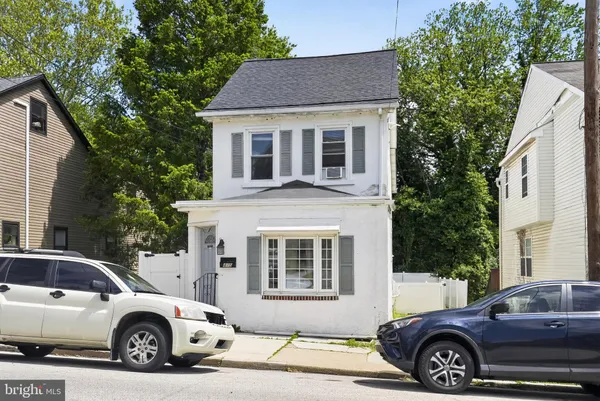a car parked in front of a house