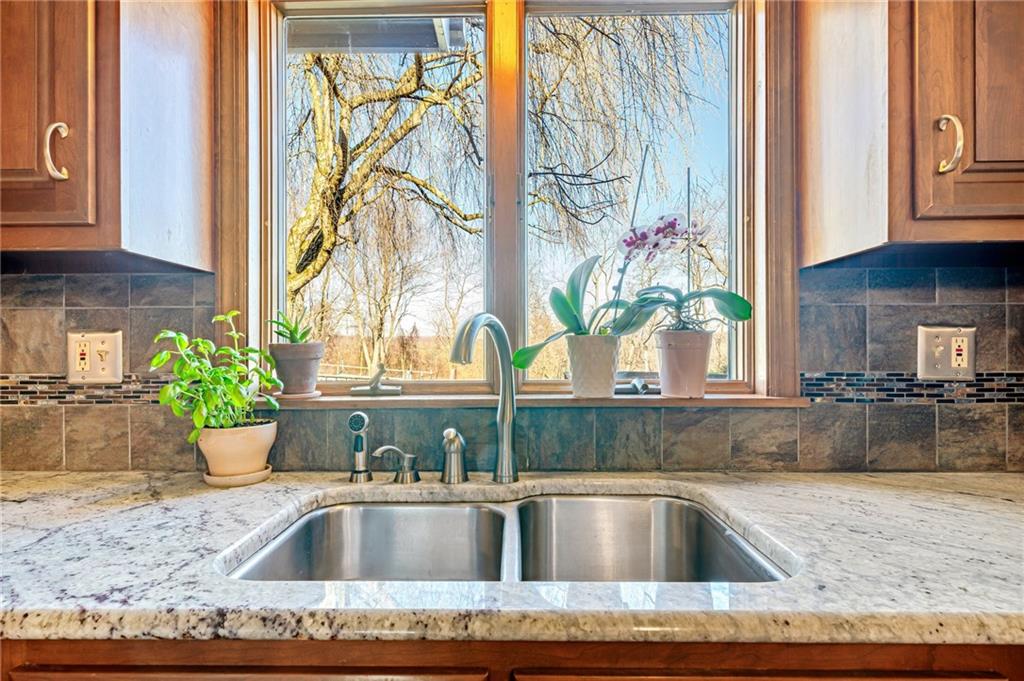 5600 Field Stream Drive Export, PA 15632 - Photo 21 of 43 a view of a kitchen sink with a granite counter top and a potted plant