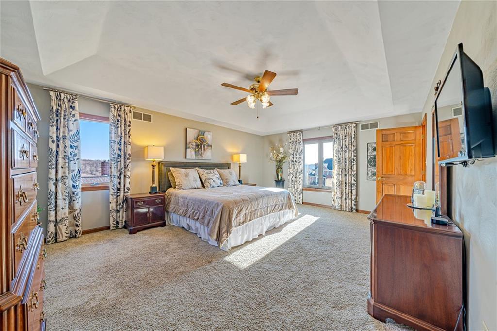 5600 Field Stream Drive Export, PA 15632 - Photo 28 of 43 a spacious bedroom with a large bed and a flat tv screen on dresser