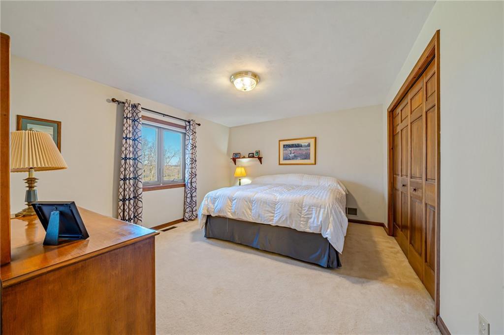 5600 Field Stream Drive Export, PA 15632 - Photo 37 of 43 a bedroom with a bed and a flat tv screen on dresser