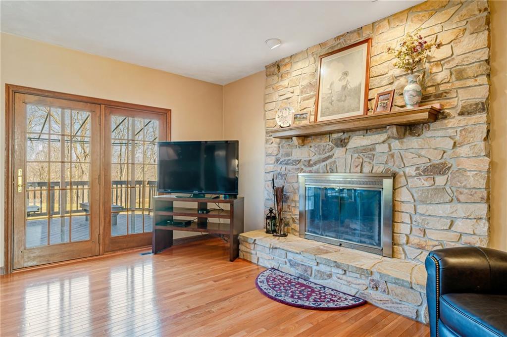 5600 Field Stream Drive Export, PA 15632 - Photo 9 of 43 a living room with furniture a flat screen tv and a fireplace