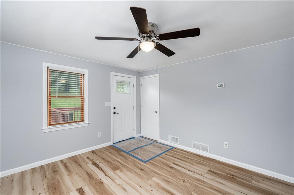 226 Kilgallen Road Butler, PA 16002 - Photo 12 of 38 a view of empty room with wooden floor and window