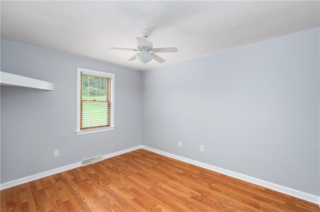 226 Kilgallen Road Butler, PA 16002 - Photo 18 of 38 an empty room with a window and ceiling fan