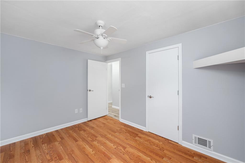 226 Kilgallen Road Butler, PA 16002 - Photo 19 of 38 a view of an empty room with wooden floor