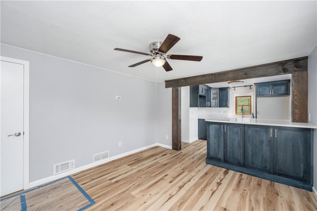 226 Kilgallen Road Butler, PA 16002 - Photo 8 of 38 a bedroom with a bed and wooden floor
