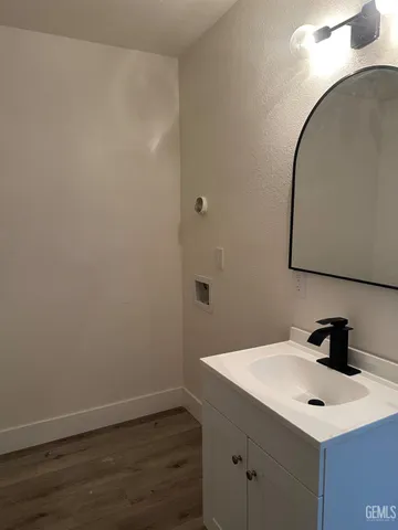 a bathroom with a sink and mirror