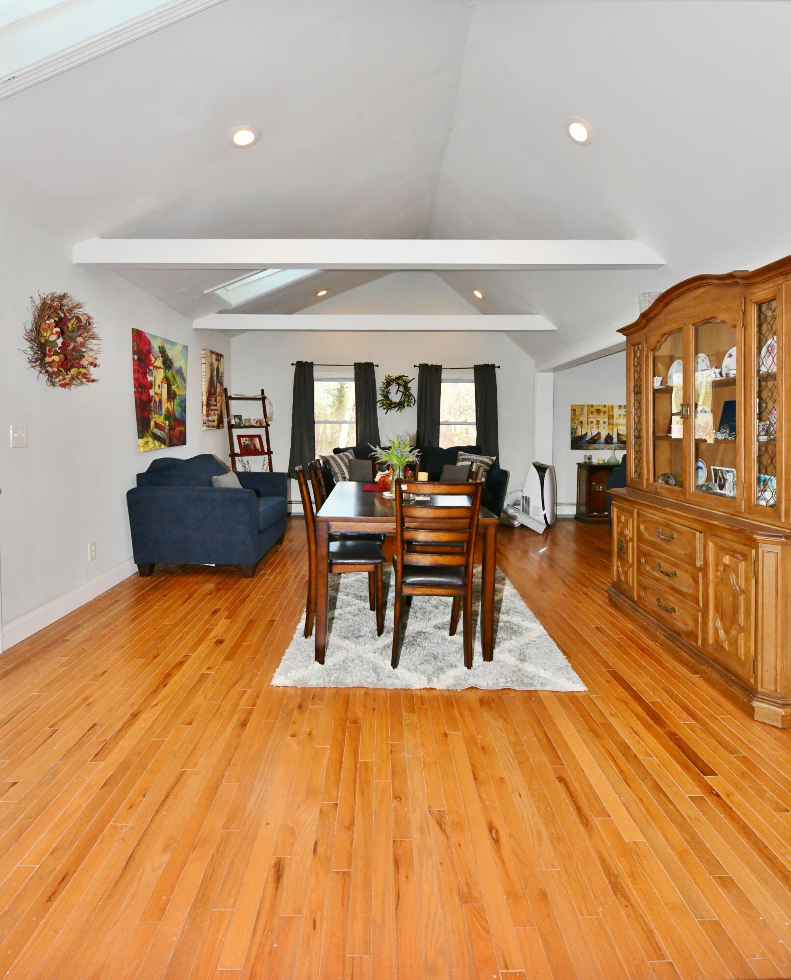 26 Old Monument Neck Road Bourne, MA 02532 - Photo 14 of 51 a living room with furniture and a wooden floor