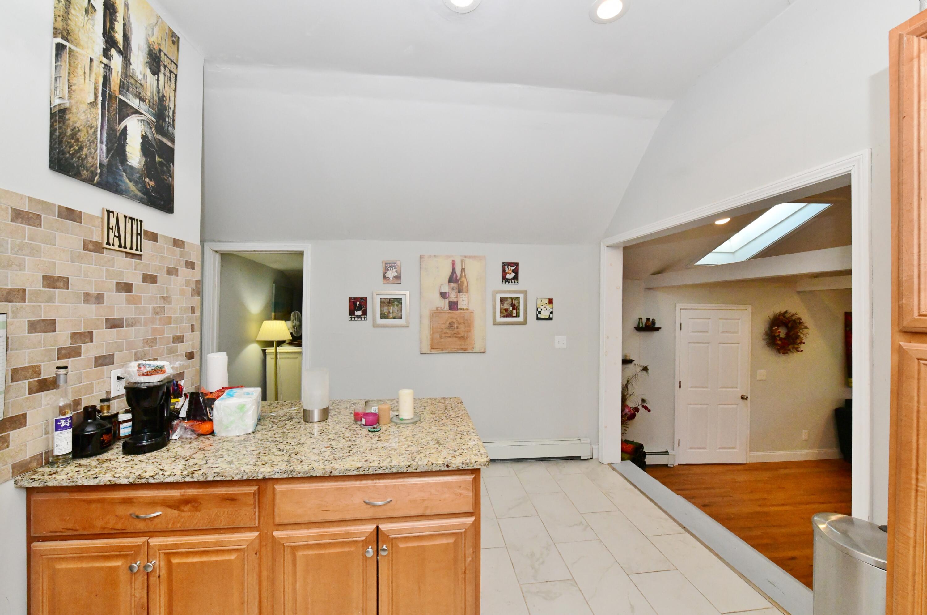 26 Old Monument Neck Road Bourne, MA 02532 - Photo 21 of 51 a bathroom with a granite countertop sink and a mirror