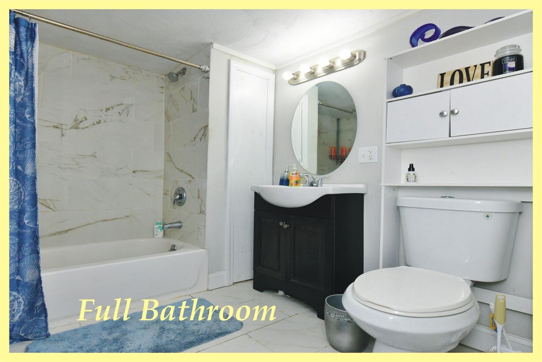 26 Old Monument Neck Road Bourne, MA 02532 - Photo 22 of 51 a bathroom with a toilet a sink and bathtub