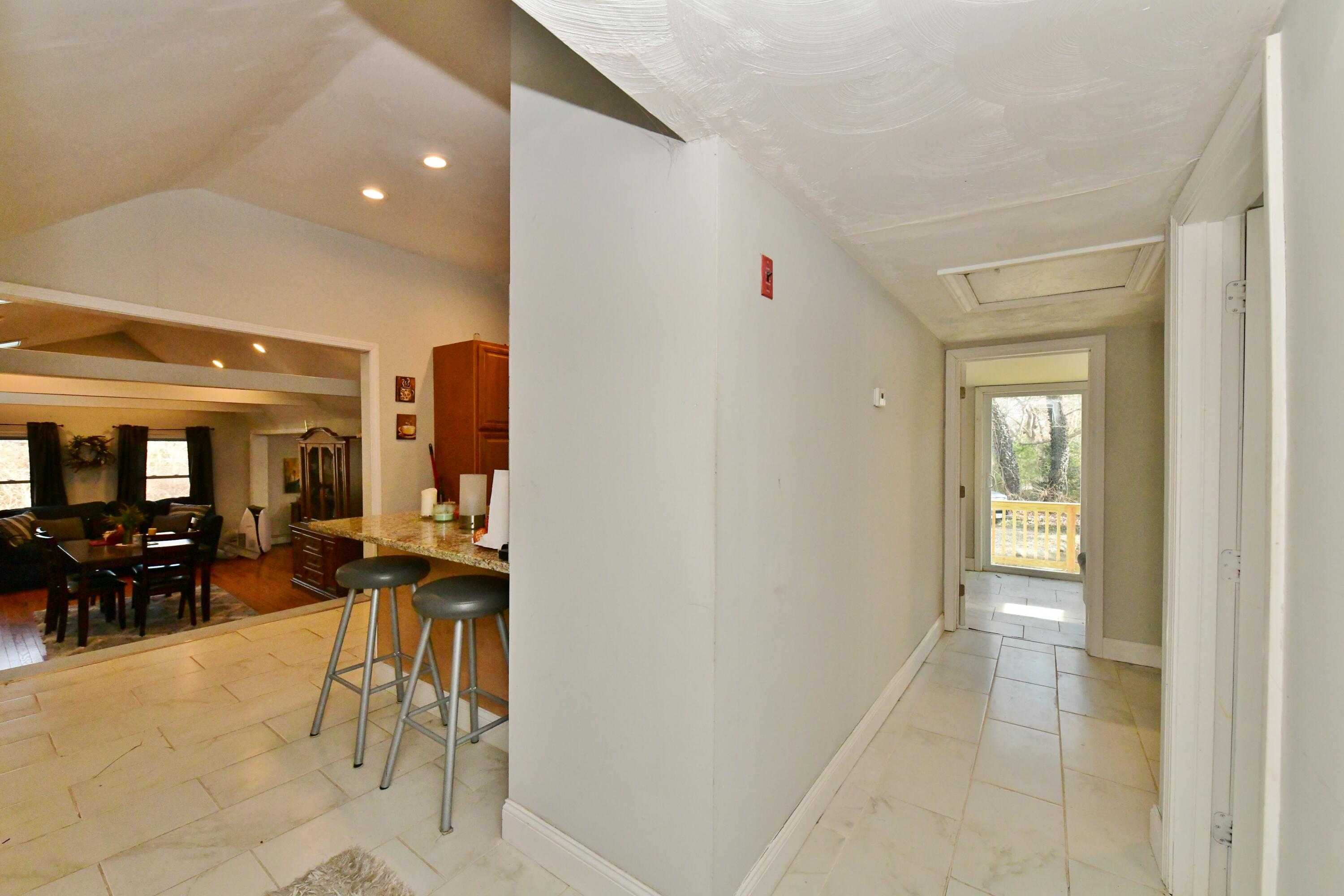 26 Old Monument Neck Road Bourne, MA 02532 - Photo 27 of 51 a view of a hallway with furniture