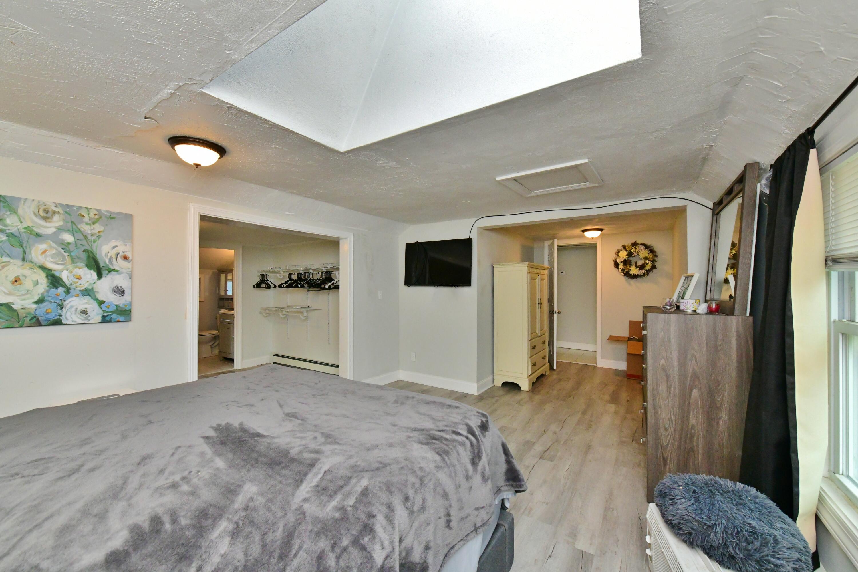 26 Old Monument Neck Road Bourne, MA 02532 - Photo 31 of 51 a bedroom with a bed and a couch