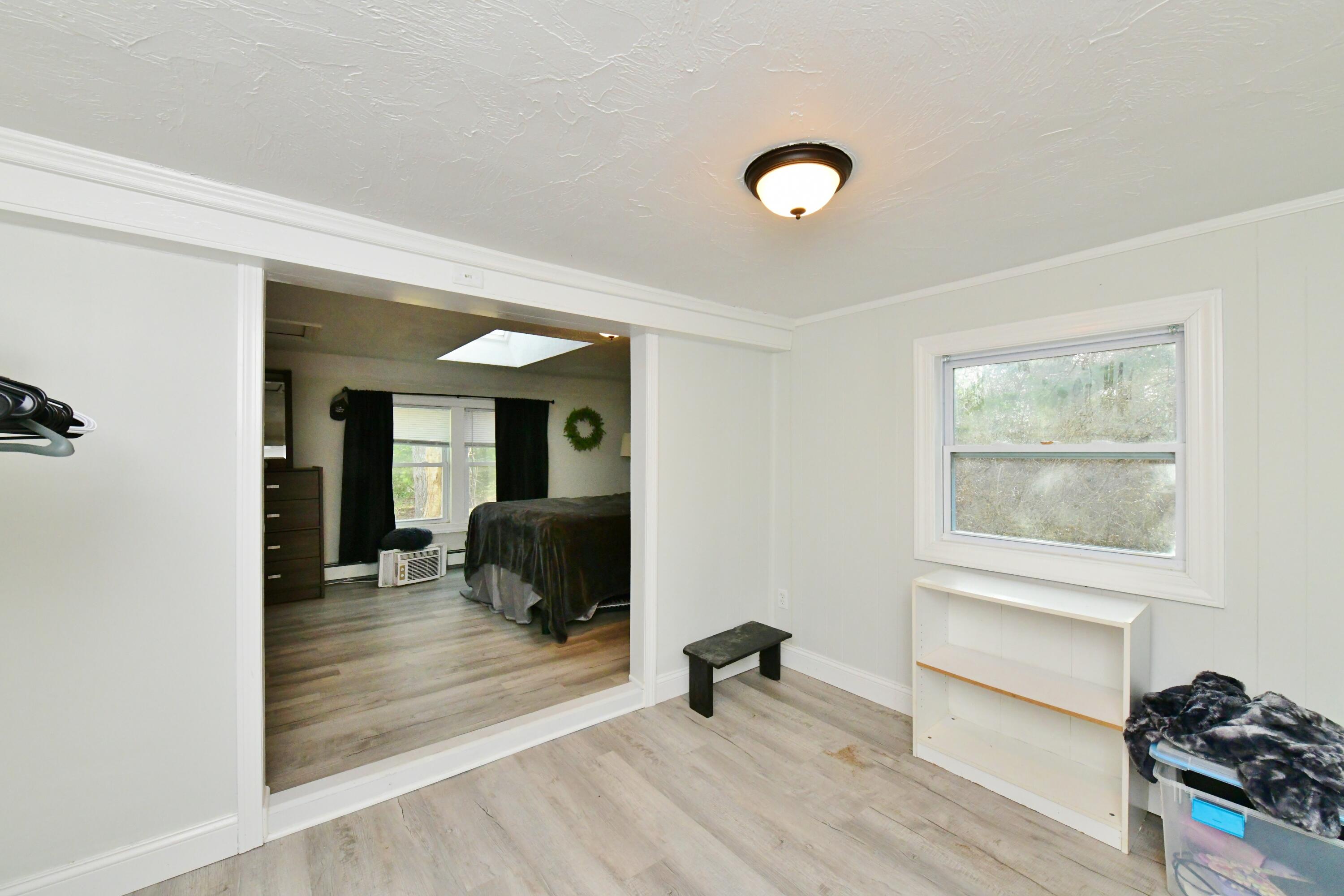 26 Old Monument Neck Road Bourne, MA 02532 - Photo 34 of 51 a view of a livingroom with wooden floor and furniture