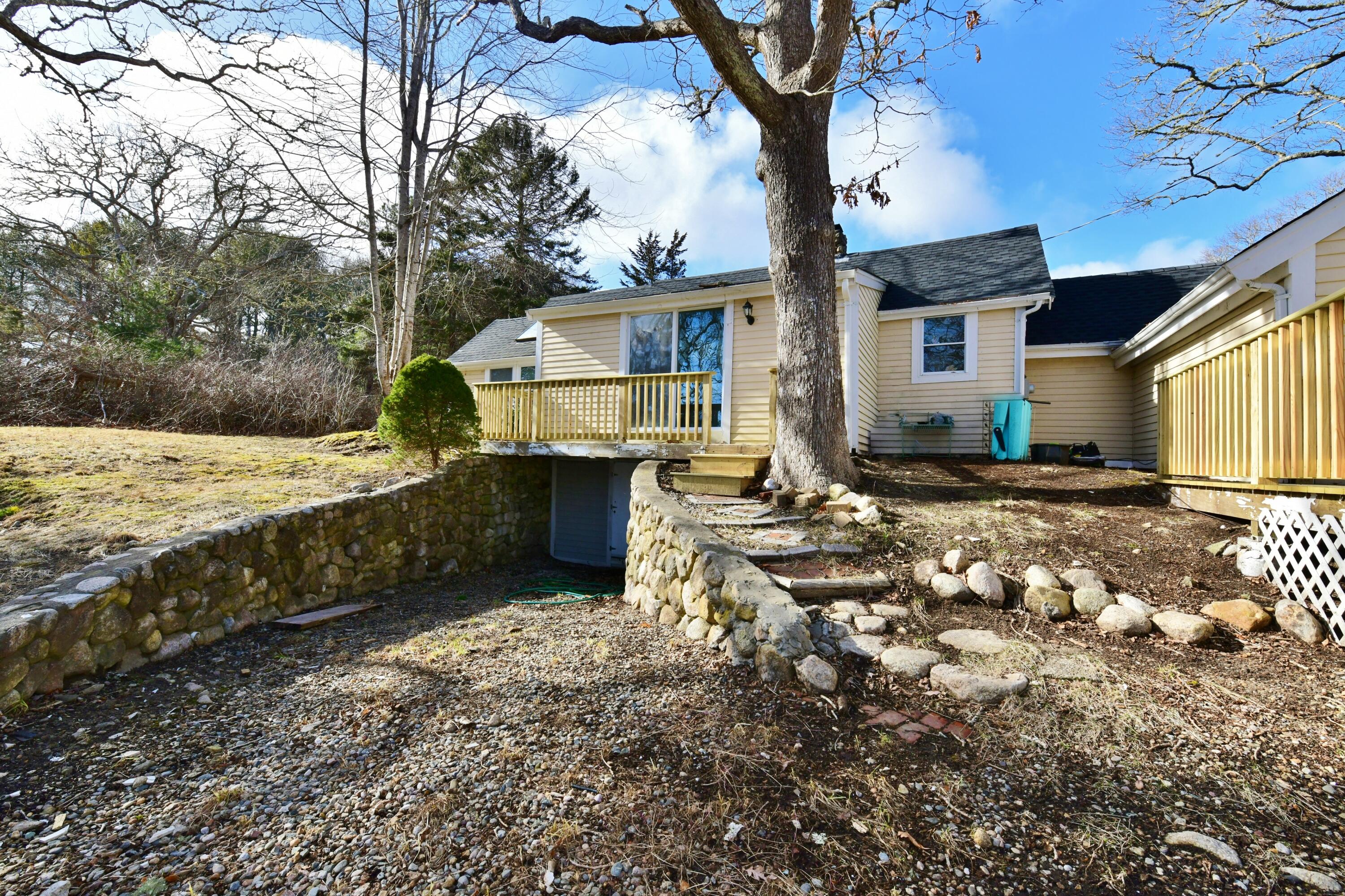 26 Old Monument Neck Road Bourne, MA 02532 - Photo 40 of 51 a front view of a house with a yard