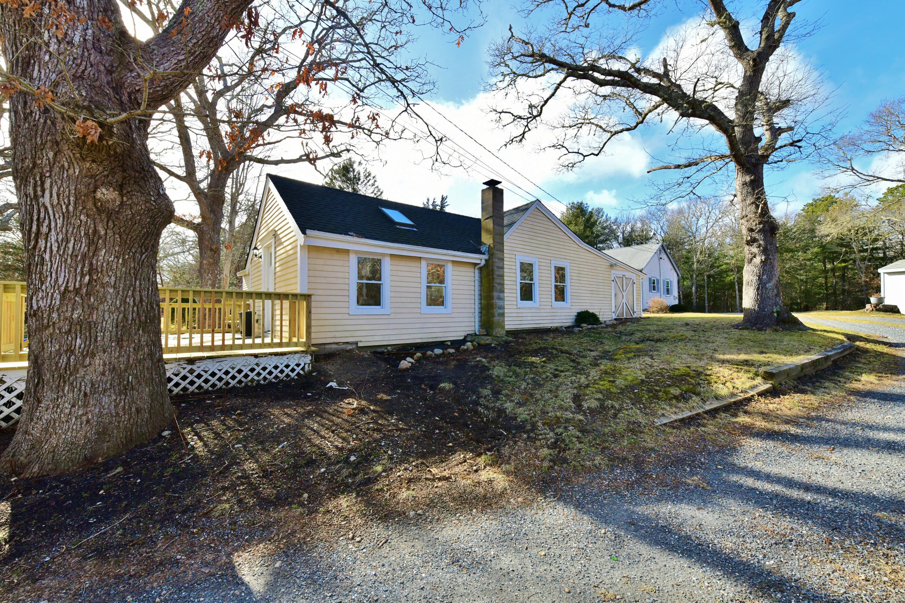 26 Old Monument Neck Road Bourne, MA 02532 - Photo 41 of 51 a view of a house with a yard