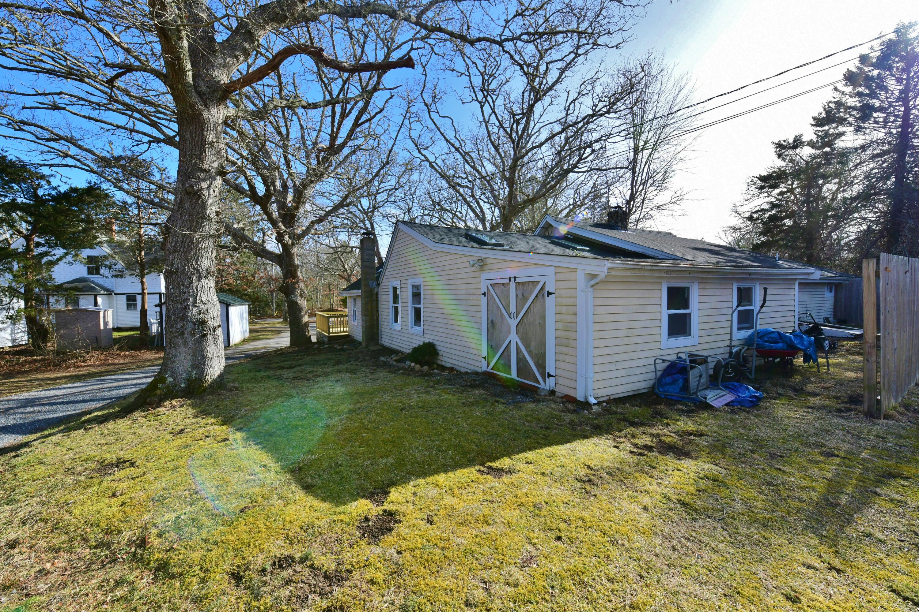 26 Old Monument Neck Road Bourne, MA 02532 - Photo 42 of 51 a view of a house with a yard