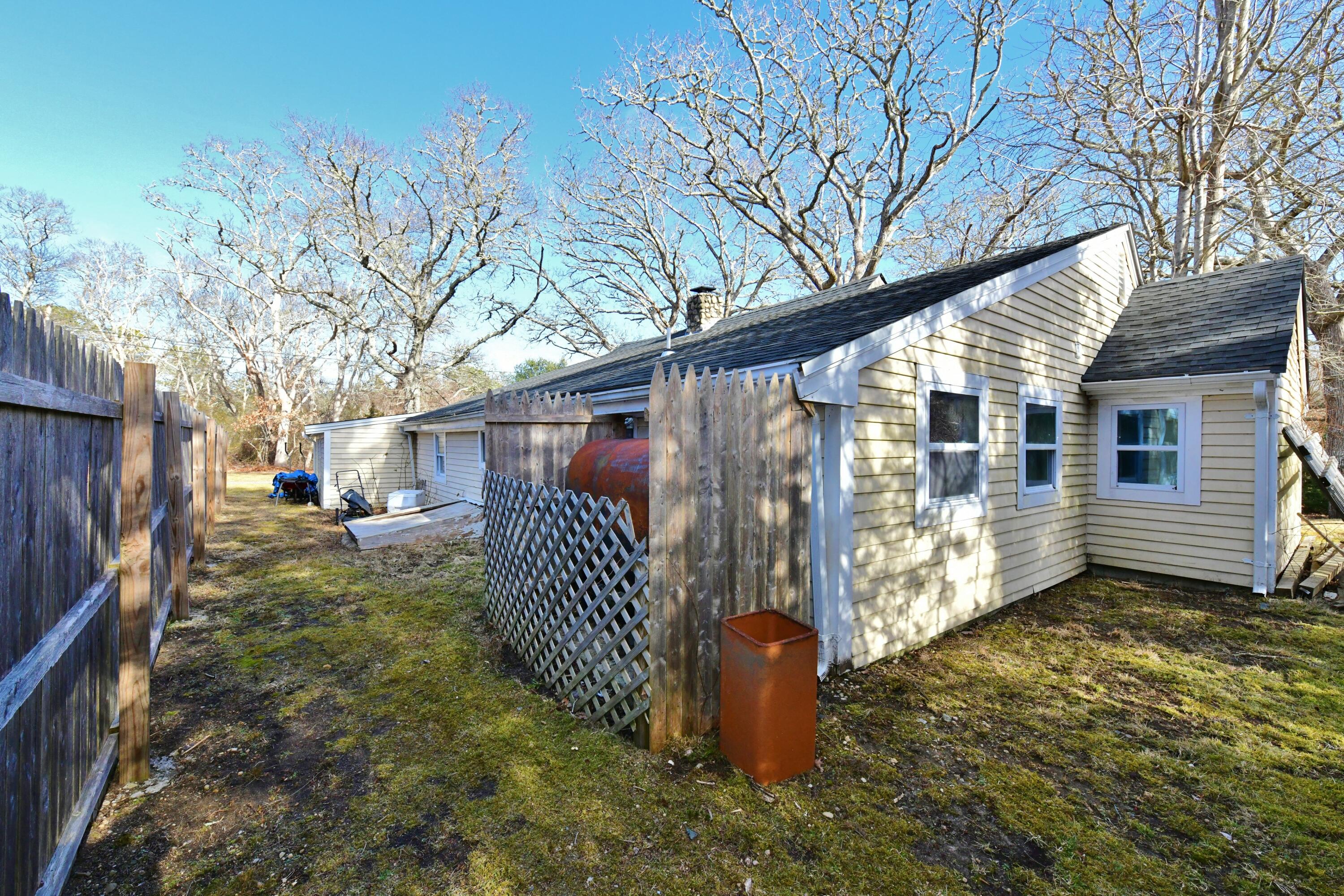 26 Old Monument Neck Road Bourne, MA 02532 - Photo 44 of 51 a view of a house with a yard