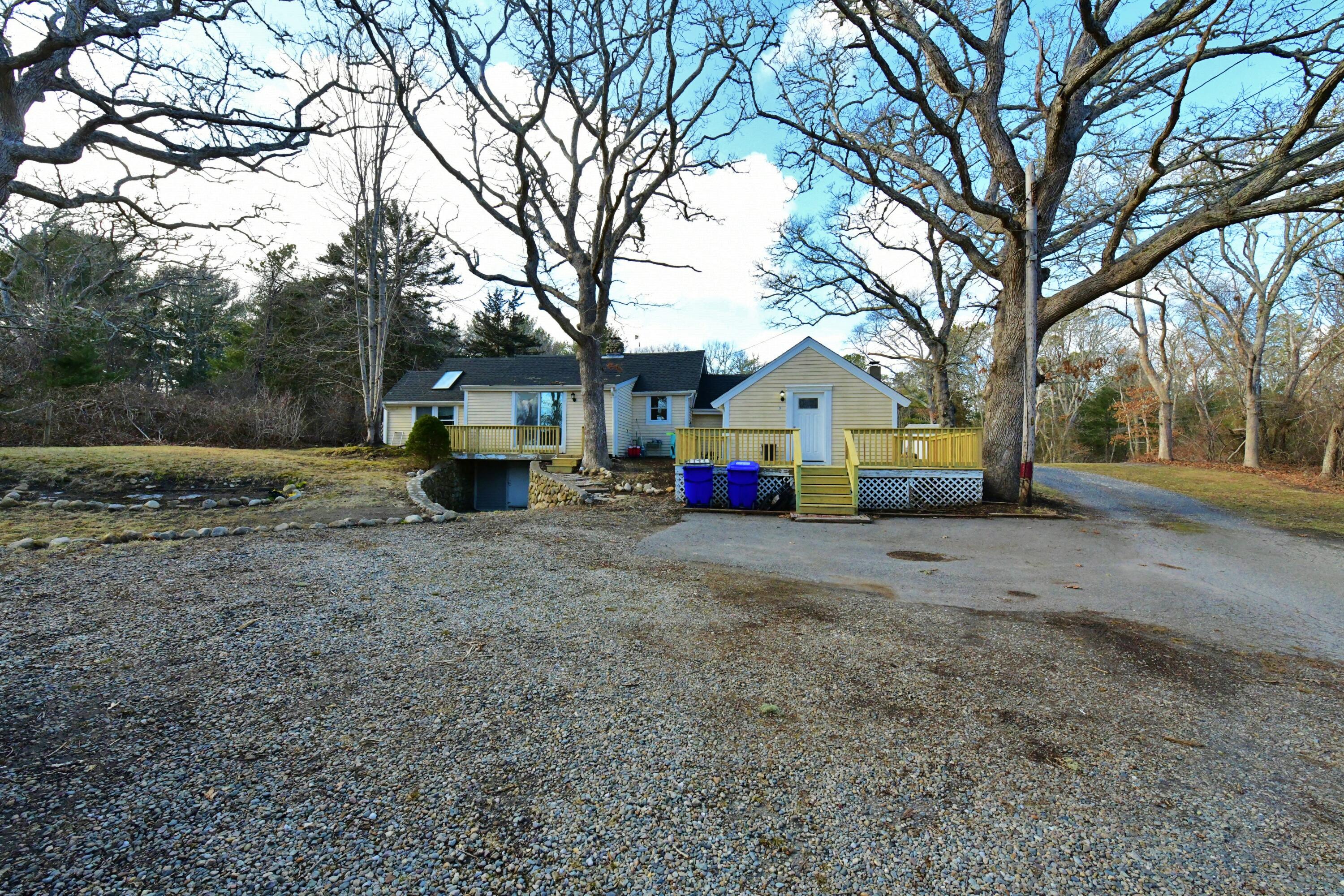 26 Old Monument Neck Road Bourne, MA 02532 - Photo 45 of 51 a view of house with tree in front of it