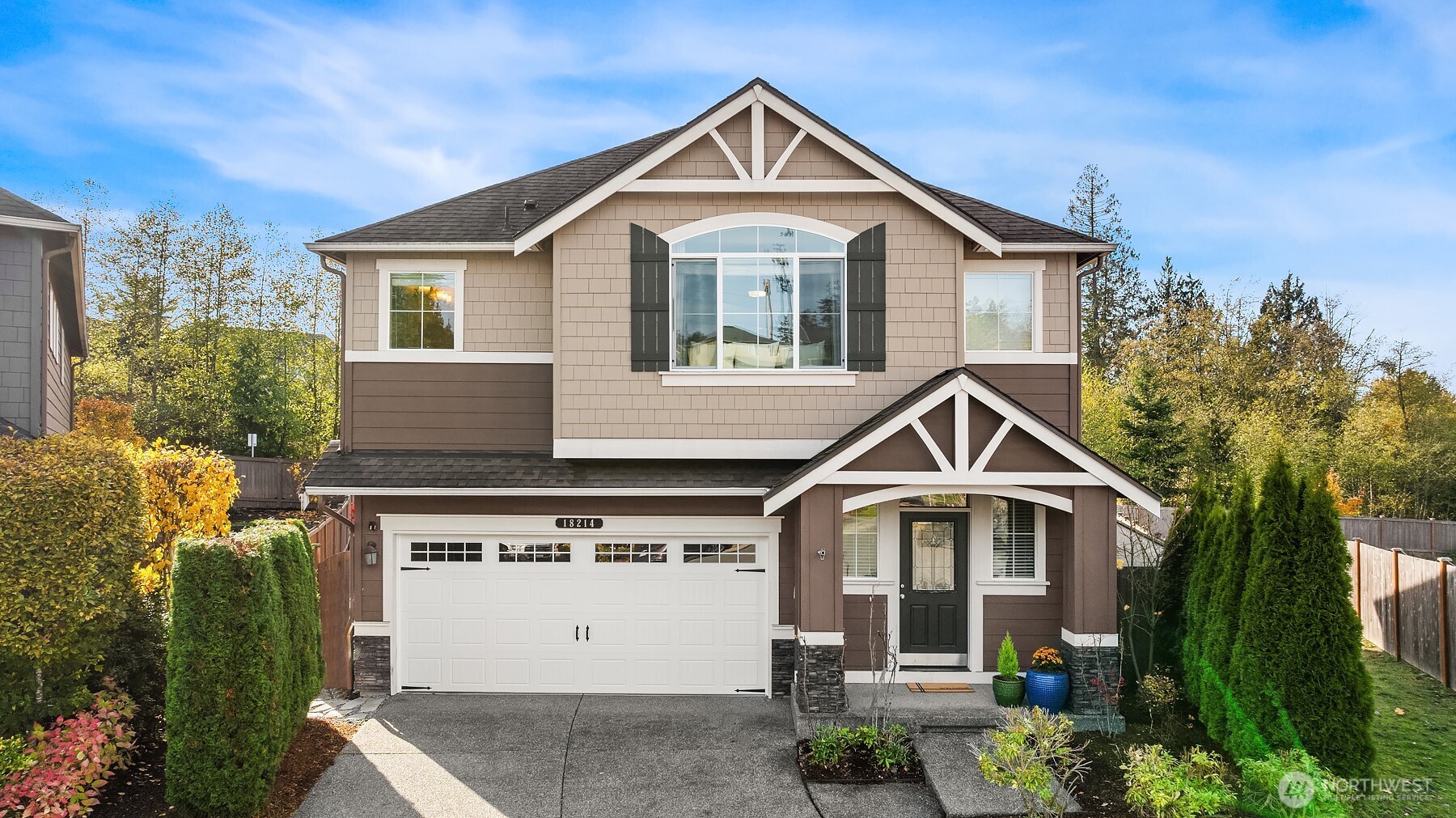 18214 41st Avenue Southeast Bothell, WA 98012 - Photo 1 of 40 a front view of a house with a yard and garage