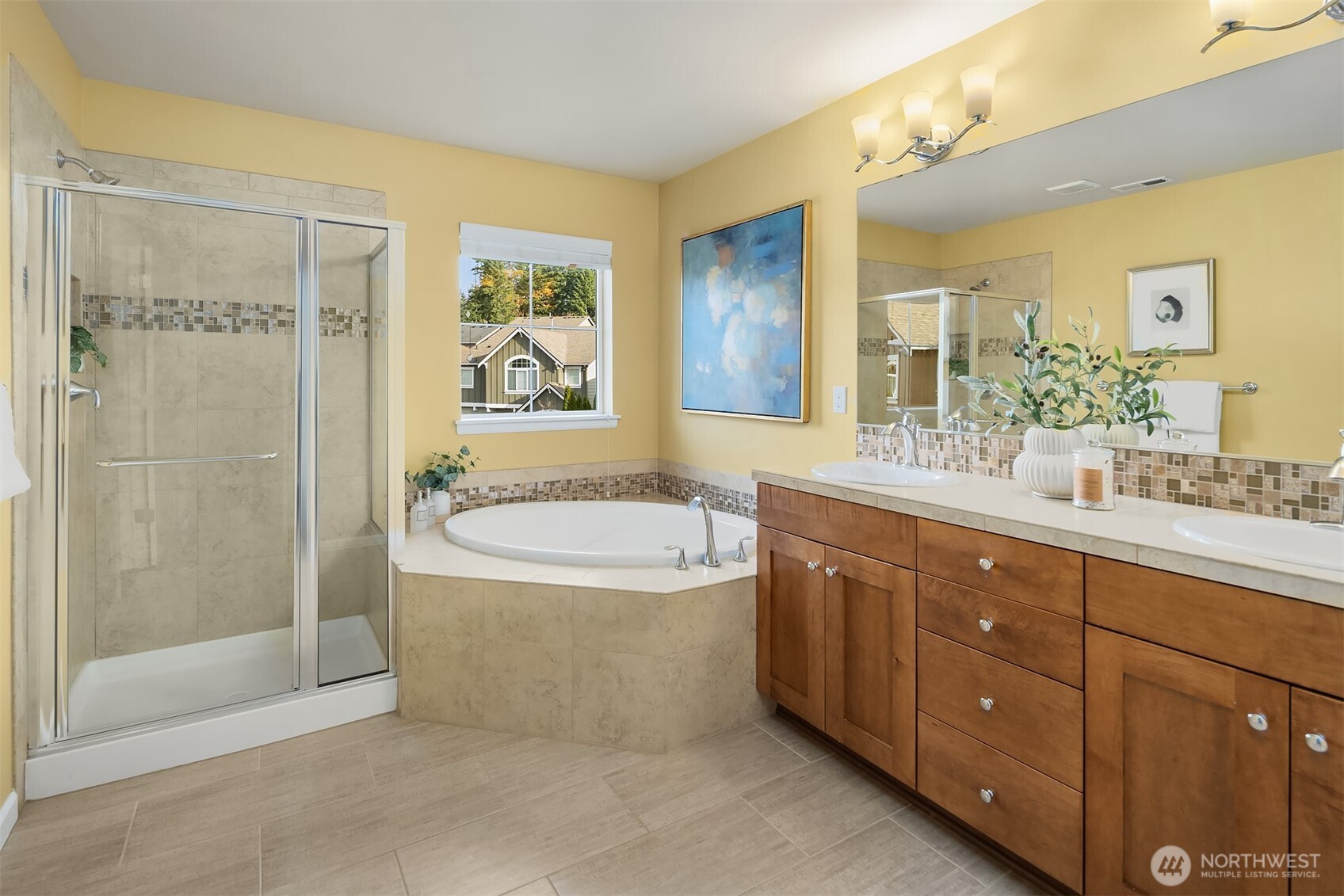 18214 41st Avenue Southeast Bothell, WA 98012 - Photo 21 of 40 a spacious bathroom with a granite countertop tub sink a mirror a shower and vanity