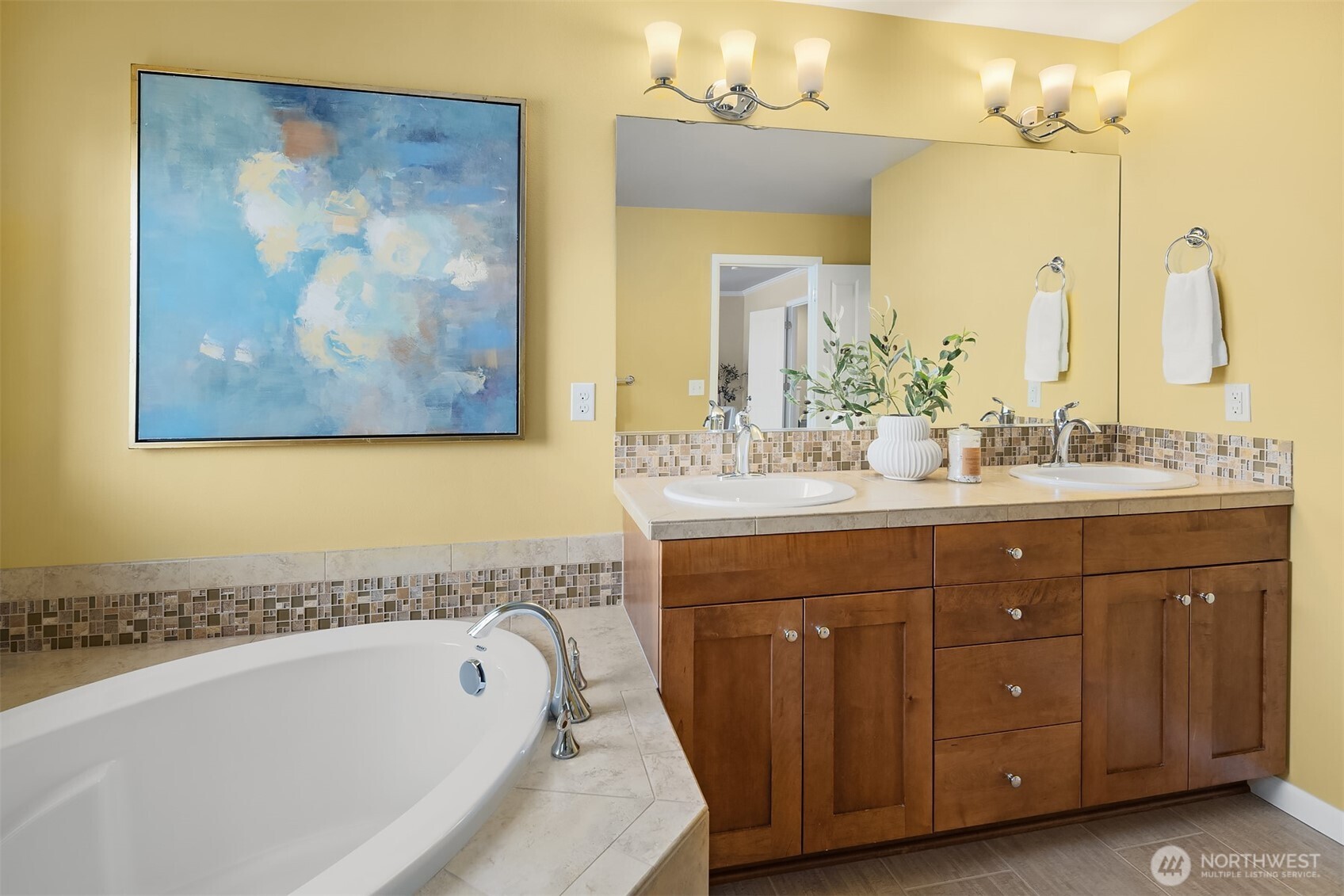 18214 41st Avenue Southeast Bothell, WA 98012 - Photo 22 of 40 a spacious bathroom with a tub double sink and mirror