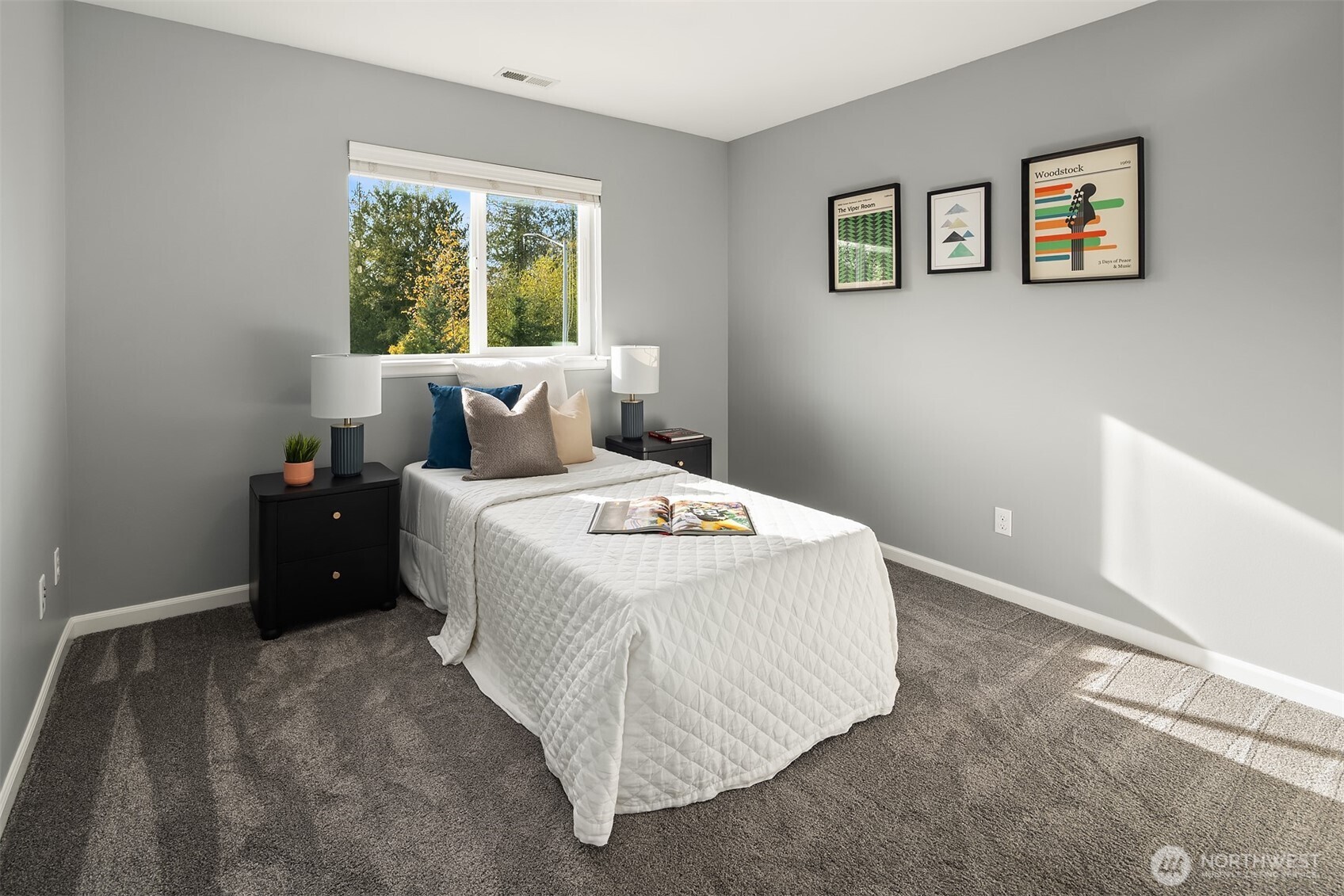 18214 41st Avenue Southeast Bothell, WA 98012 - Photo 27 of 40 a bed sitting in a bedroom next to a window