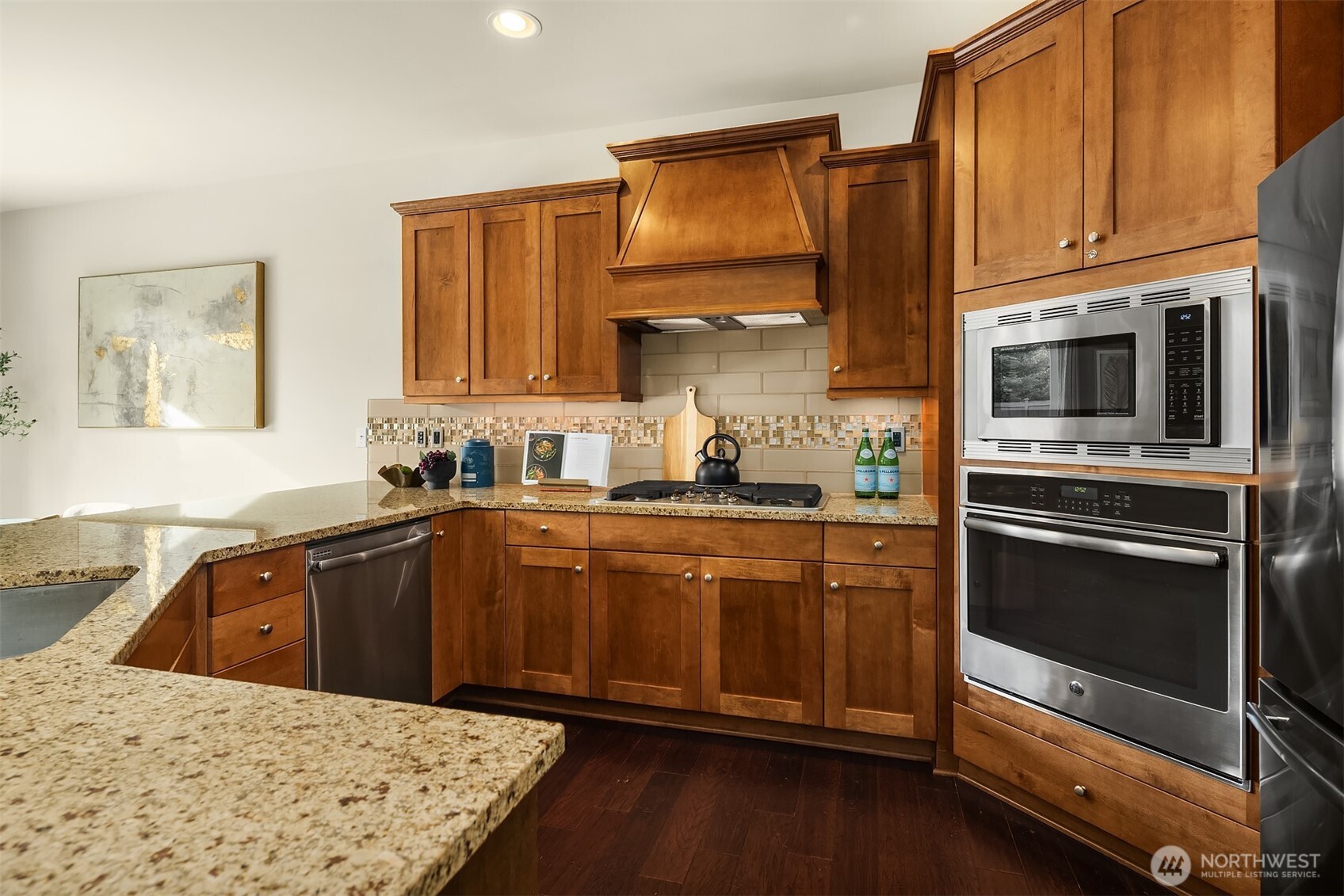 18214 41st Avenue Southeast Bothell, WA 98012 - Photo 6 of 40 a kitchen with stainless steel appliances granite countertop a stove microwave and sink