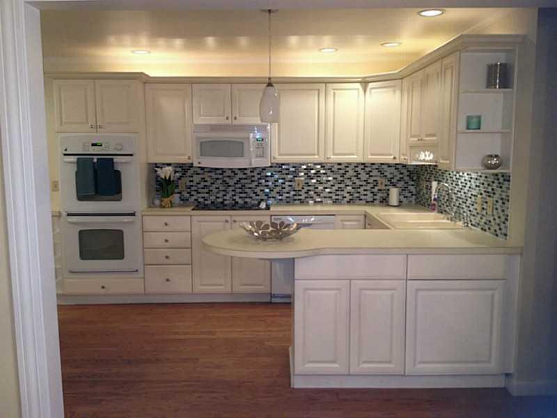 150 Donaldson Road Gibsonia, PA 15044 - Photo 4 of 25 Kitchen. Fresh white kitchen open to the dining room with a gorgeous backsplash and all new appliances
