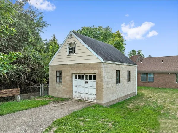 a sign on a pole on a street