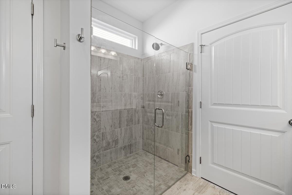 3616 Cross Timber Lane Raleigh, NC 27603 - Photo 17 of 39 a bathroom with a glass shower door