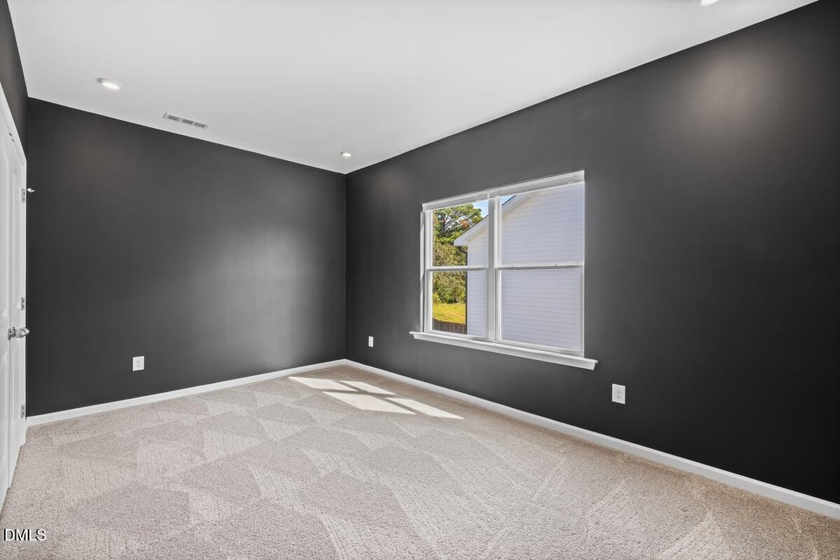 3616 Cross Timber Lane Raleigh, NC 27603 - Photo 23 of 39 a view of an empty room with a window