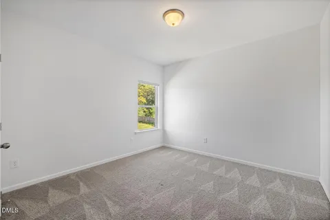 an empty room with a empty space and a window