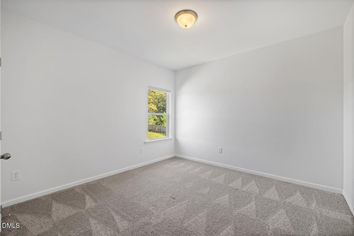 3616 Cross Timber Lane Raleigh, NC 27603 - Photo 25 of 39 a view of an empty room with a window