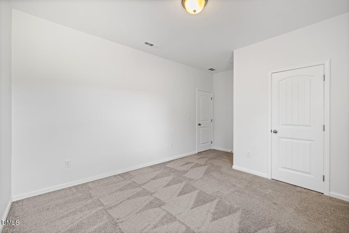 3616 Cross Timber Lane Raleigh, NC 27603 - Photo 27 of 39 an empty room with a empty space and a window