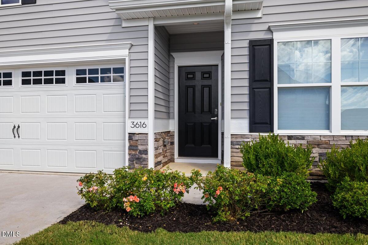3616 Cross Timber Lane Raleigh, NC 27603 - Photo 2 of 39 front view of a house with a yard