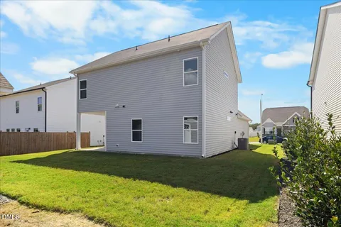 an aerial view of a house with a swimming pool