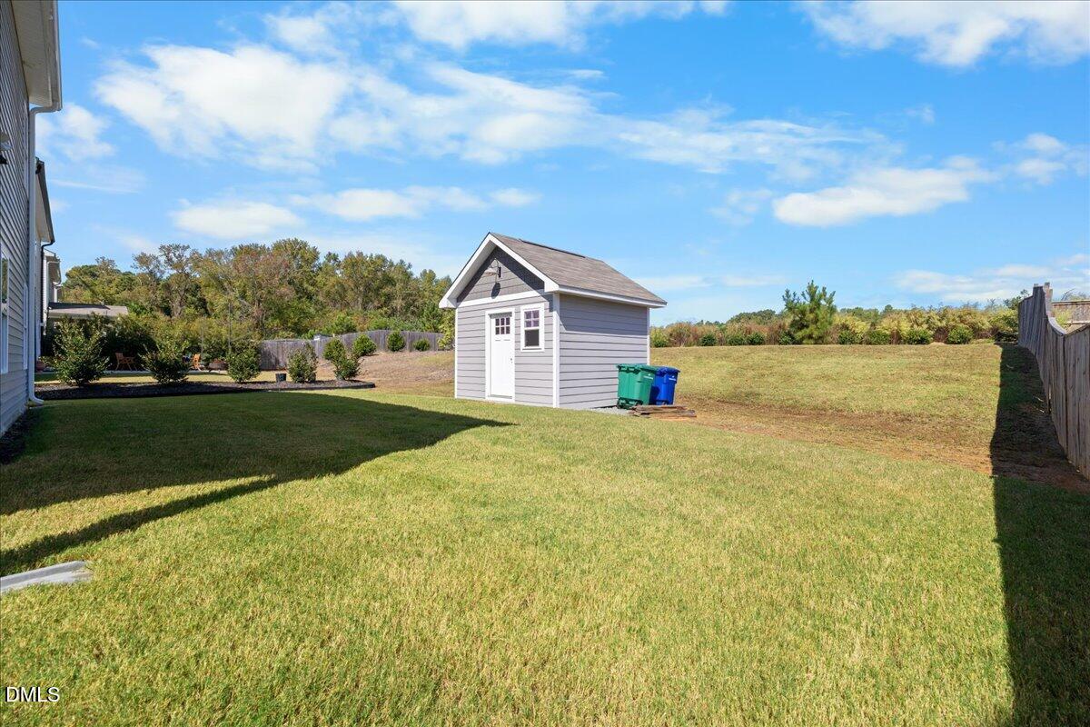 3616 Cross Timber Lane Raleigh, NC 27603 - Photo 34 of 39 a view of big house with a big yard and potted plants