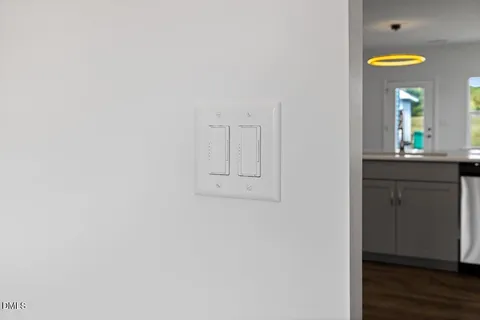 a view of a room with a window and wooden floor