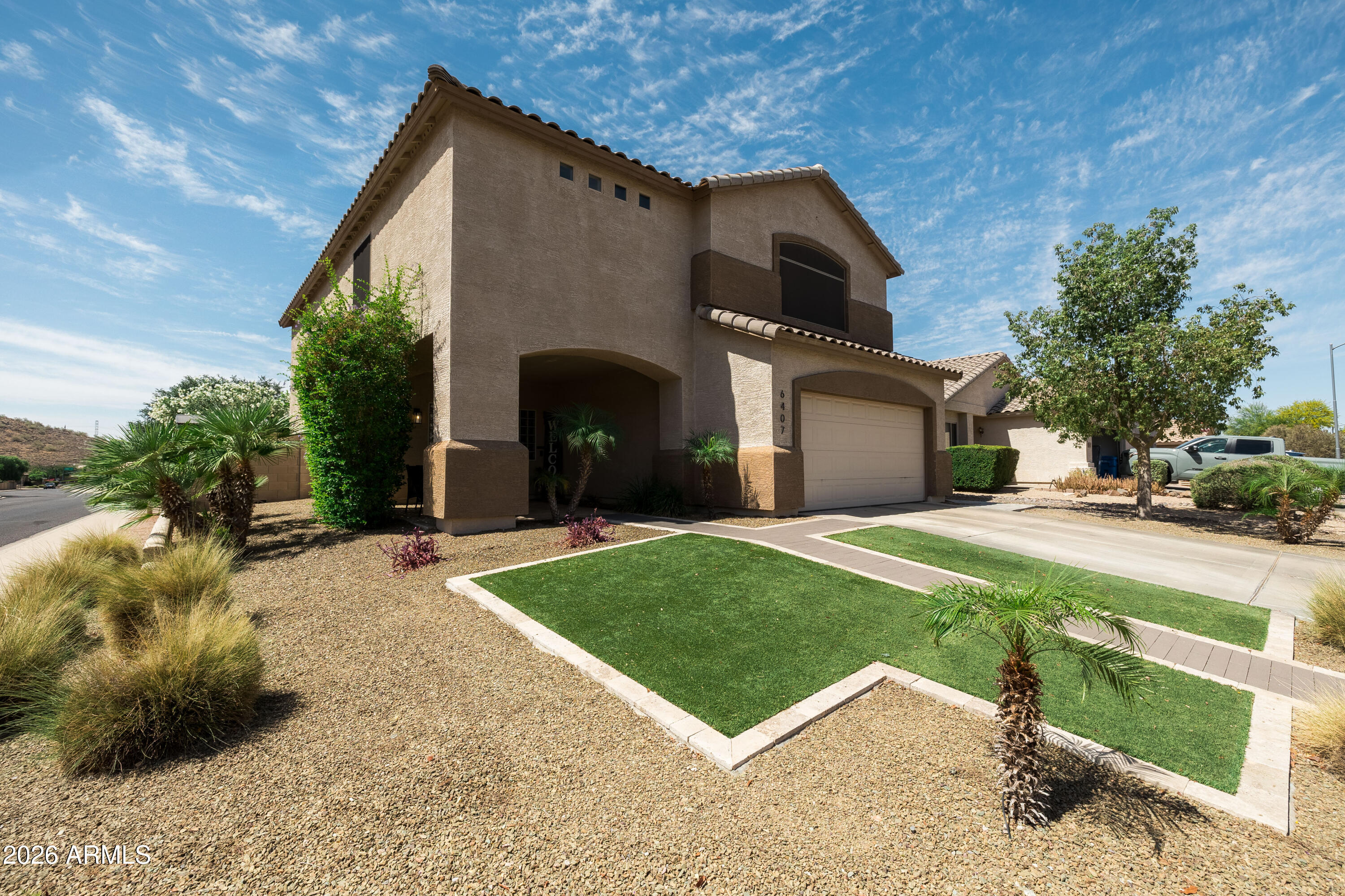 6407 West Saddlehorn Road Phoenix, AZ 85083 - Photo 3 of 41 a front view of a house with a yard