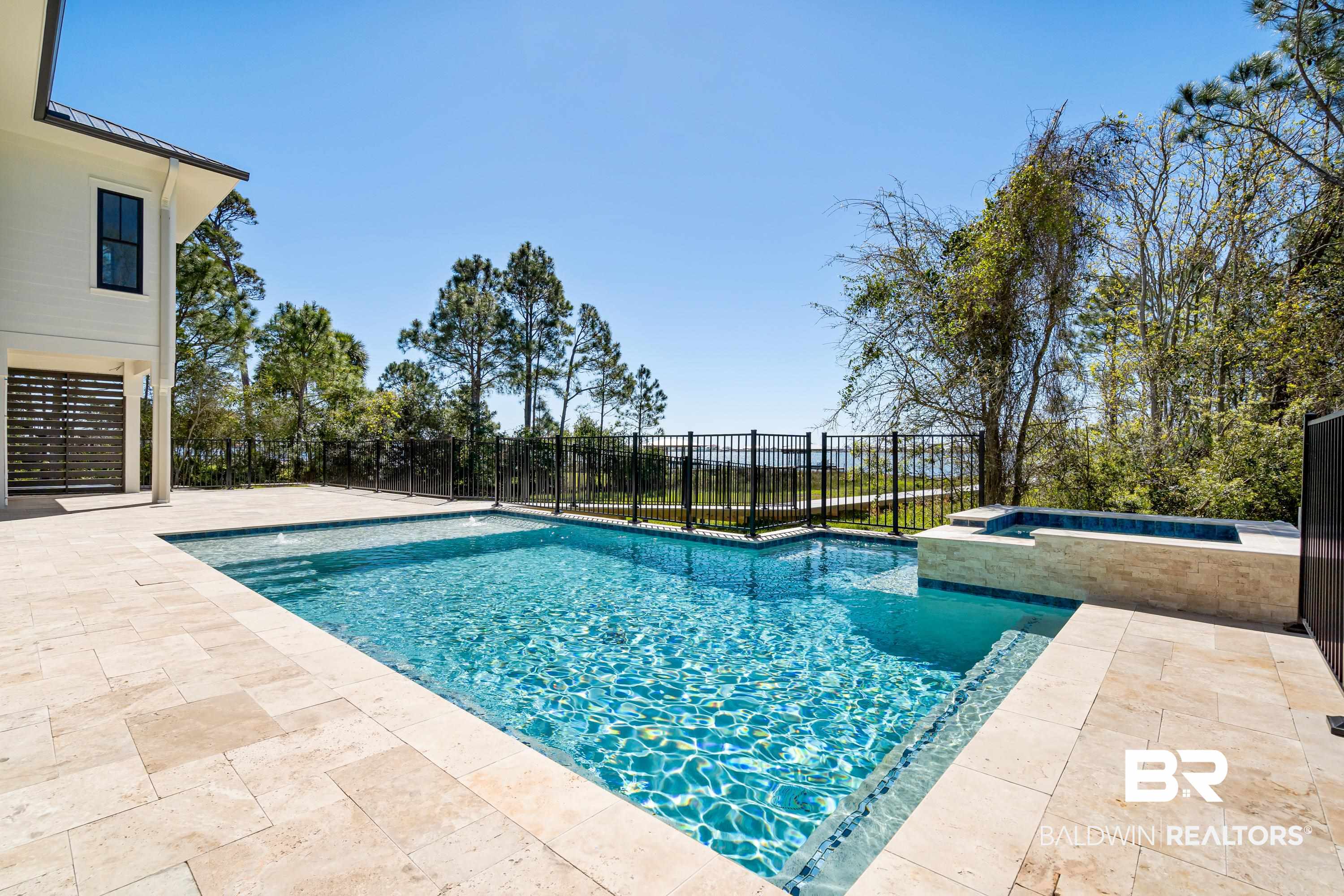 14686 State Highway Gulf Shores, AL 36542 - Photo 29 of 44 View of swimming pool with fence, an in ground hot tub, a patio area, and a fenced in pool