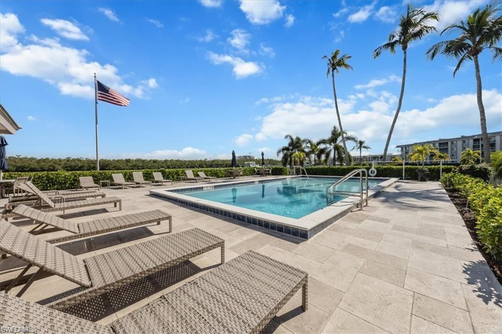 309 Goodlette-Frank Road, Unit A406 Naples, FL 34102 - Photo 17 of 20 a view of a terrace with chairs