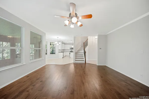 a kitchen with stainless steel appliances granite countertop a sink and refrigerator