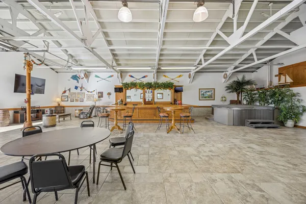 a living room with lots of furniture and a chandelier
