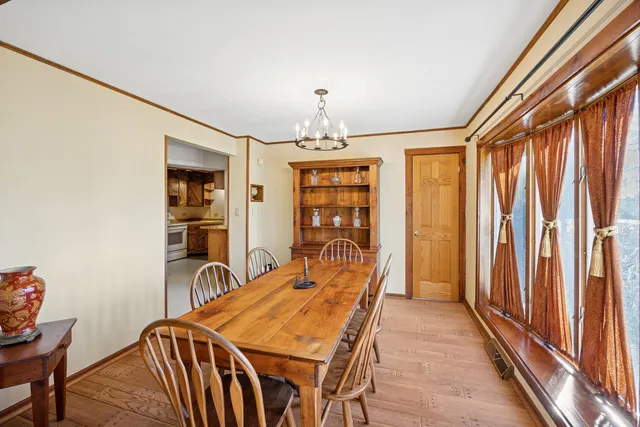 a dining room with furniture and window