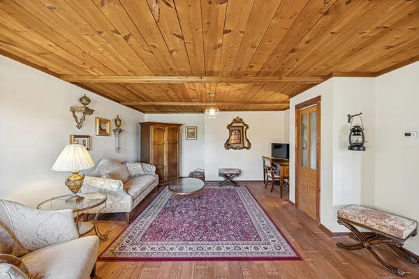 a living room with furniture and a rug