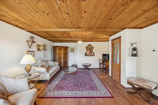 a living room with furniture and a rug
