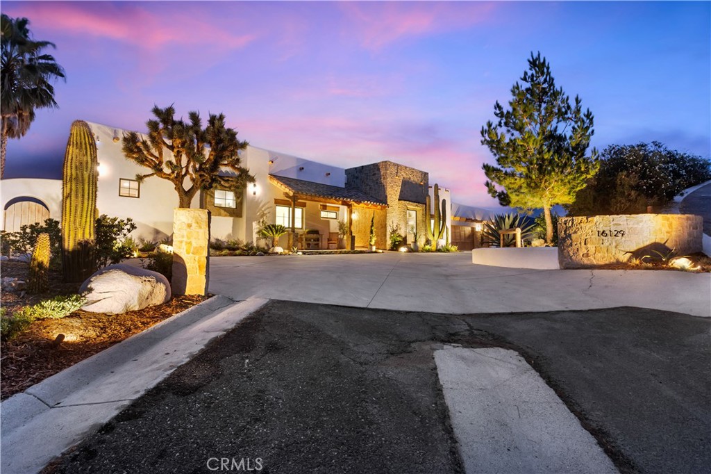 16129 Sky Ranch Road Canyon Country, CA 91387 - Photo 1 of 1 a view of a yard with cars park